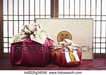 Stock Photograph - Korean traditional packages and a present set in front of Korean traditional paper door. Fotosearch