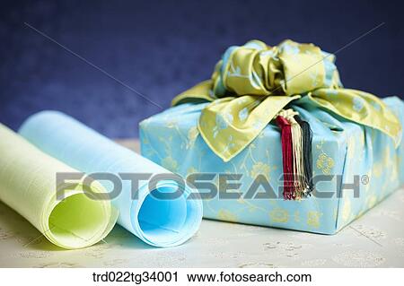 Stock Image - Korean traditional papers next to a package wrapped in traditional wrap . Fotosearch
