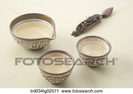 Stock Image - Korean traditional tea in Korean traditional cups. Fotosearch