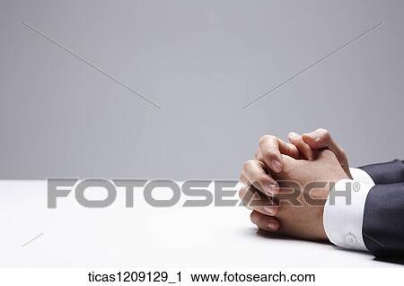 man clasping his hands View Large Photo Image Stock Image - man clasping his hands . Fotosearch