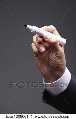 man grabbing a pen View Large Photo Image Stock Image - man grabbing a pen . Fotosearch