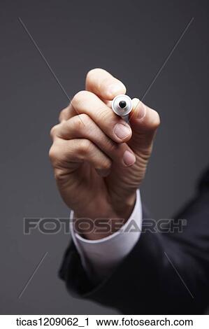 man grabbing a pen View Large Photo Image Stock Image - man grabbing a pen . Fotosearch