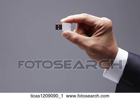 man holding a USB port View Large Photo Image Stock Image - man holding a USB port. Fotosearch