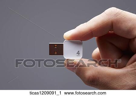 man holding a USB port View Large Photo Image Stock Image - man holding a USB port. Fotosearch