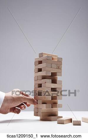 man playing Jenga View Large Photo Image Stock Image - man playing Jenga. Fotosearch