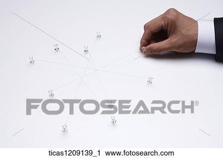 Stock Image - man tacking on the paper . Fotosearch
