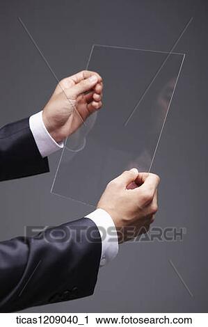 man touching a piece of glass View Large Photo Image Stock Image - man touching a piece of glass. Fotosearch