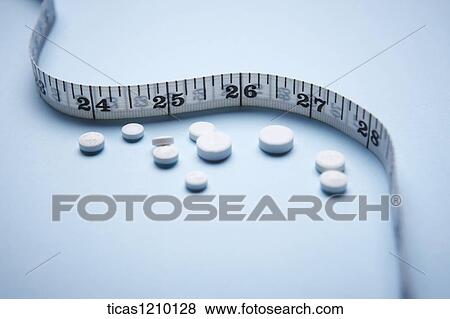 measurement tape and tablets View Large Photo Image Stock Photo - measurement tape and tablets . Fotosearch