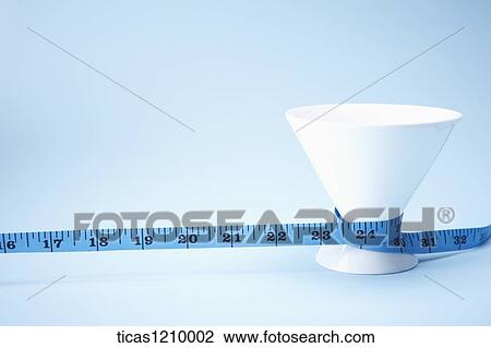 Stock Image - measurement tape around the think part of a cup. Fotosearch