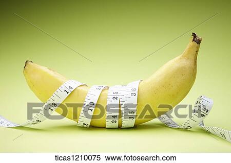 measurement tape surrounding a banana View Large Photo Image Stock Photography - measurement tape surrounding a banana. Fotosearch
