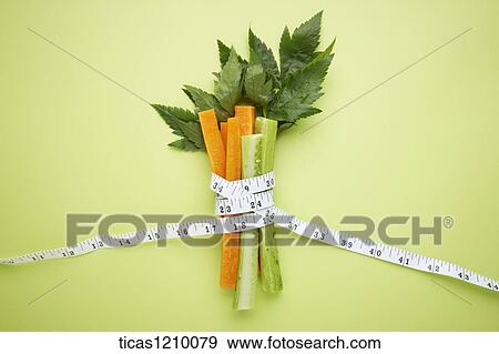 measurement tape surrounding cut vegetables View Large Photo Image Stock Photo - measurement tape surrounding cut vegetables . Fotosearch