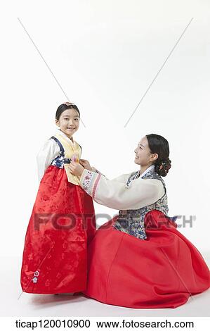 mother fixing daughter's Hanbok View Large Photo Image Stock Image - mother fixing daughter's Hanbok. Fotosearch