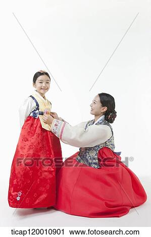 mother fixing daughter's Hanbok View Large Photo Image Stock Image - mother fixing daughter's Hanbok. Fotosearch