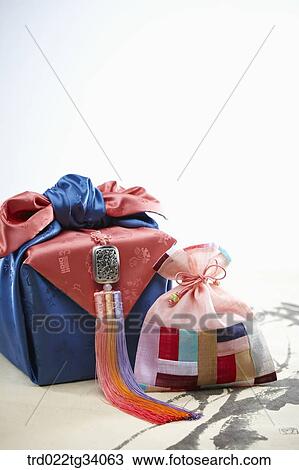 norigae and Korean traditional package and small bag on Korean traditional paper View Large Photo Image Stock Image - norigae and Korean traditional package and small bag on Korean traditional paper. Fotosearch