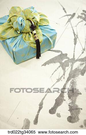 Stock Photography - norigae and Korean traditional package on Korean traditional paper. Fotosearch
