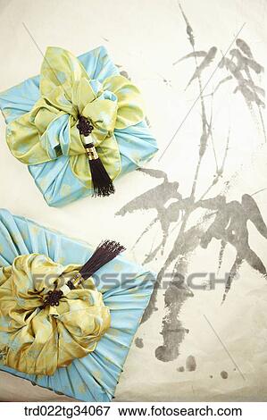 norigae and Korean traditional packages on Korean traditional paper View Large Photo Image Stock Photo - norigae and Korean traditional packages on Korean traditional paper. Fotosearch