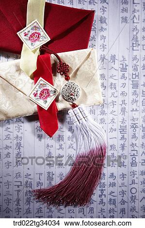 Picture - norigae on Korean traditional cloth wallet. Fotosearch