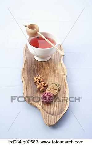 Stock Image - omija tea and Korean finger cakes. Fotosearch