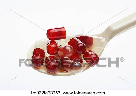 Stock Photo - pills in a spoon. Fotosearch
