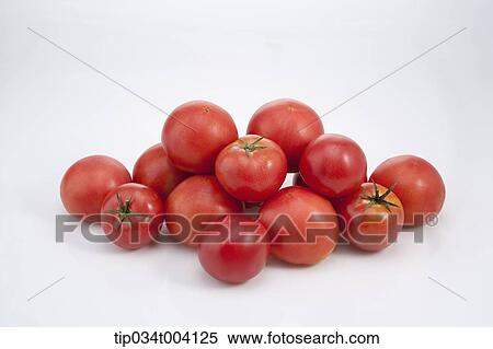 Stock Photography - red tomatoes cut in half. Fotosearch