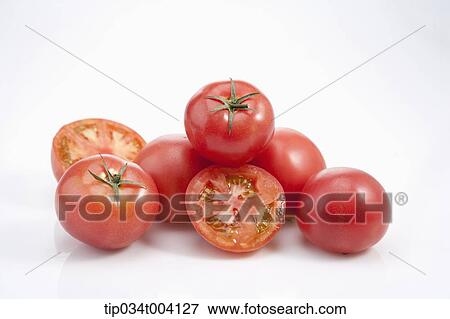 red tomatoes with a part cut out View Large Photo Image Stock Photo - red tomatoes with a part cut out . Fotosearch