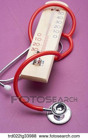 Stock Photo - stethoscope surrounding thermometer. Fotosearch