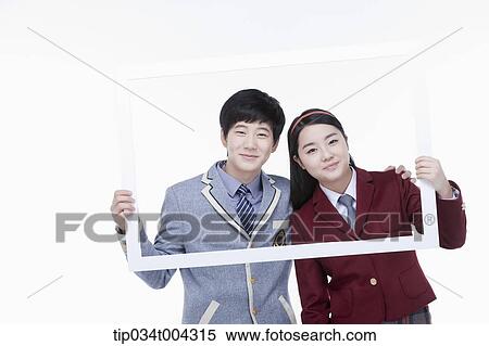students with school uniform posing inside a white frame they are holding View Large Photo Image Stock Photography - students with school uniform posing inside a white frame they are holding . Fotosearch