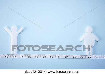 sugar shaped in human in different weights standing on measurement tape View Large Photo Image Picture - sugar shaped in human in different weights standing on measurement tape. Fotosearch