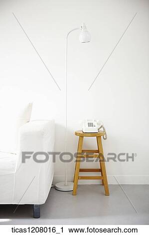 telephone and light stand next to sofa View Large Photo Image Stock Image - telephone and light stand next to sofa. Fotosearch
