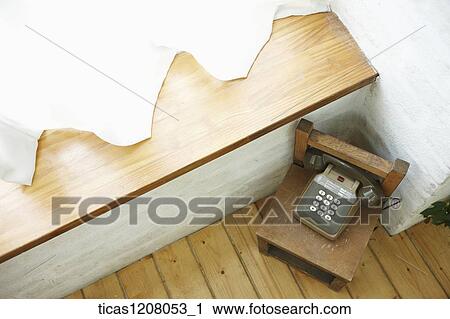 telephone on the chair next to the window View Large Photo Image Stock Image - telephone on the chair next to the window. Fotosearch