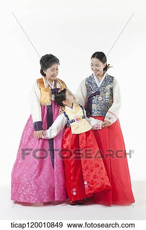 three generation family posing together View Large Photo Image Stock Photo - three generation family posing together . Fotosearch
