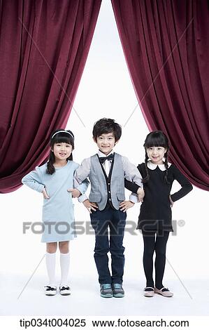 three kids on a stage arms in arms View Large Photo Image Stock Photography - three kids on a stage arms in arms . Fotosearch