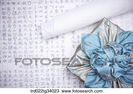 traditional papers next to a package wrapped in a traditional wrap with nice big ribbon View Large Photo Image Stock Image - traditional papers next to a package wrapped in a traditional wrap with nice big ribbon . Fotosearch