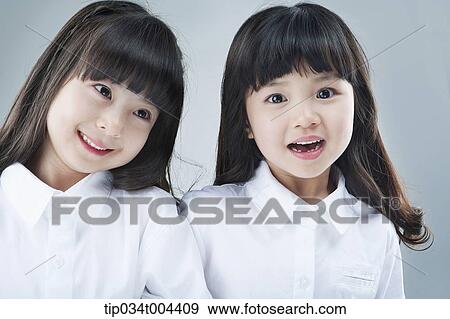 Stock Photo - two female kids smiling together. Fotosearch