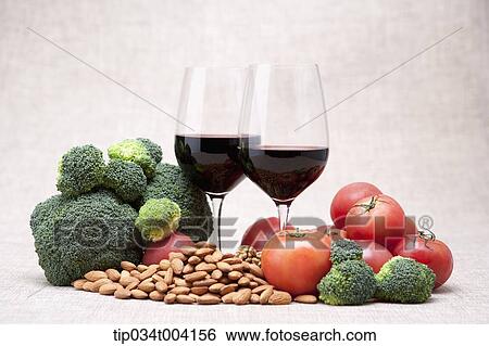 two glasses of red wine with broccoli and tomatoes View Large Photo Image Stock Photograph - two glasses of red wine with broccoli and tomatoes. Fotosearch