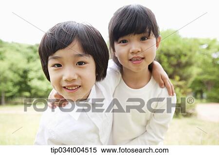 two kids posing with arms around each other View Large Photo Image Stock Photography - two kids posing with arms around each other. Fotosearch