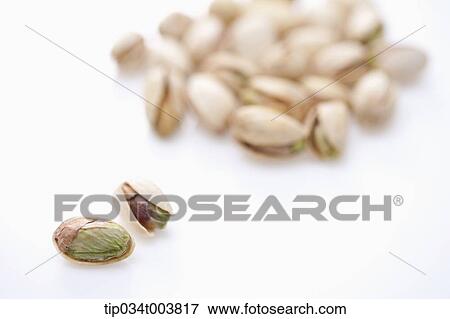 two pistachios in front of bunch of pistachios View Large Photo Image Stock Photo - two pistachios in front of bunch of pistachios. Fotosearch