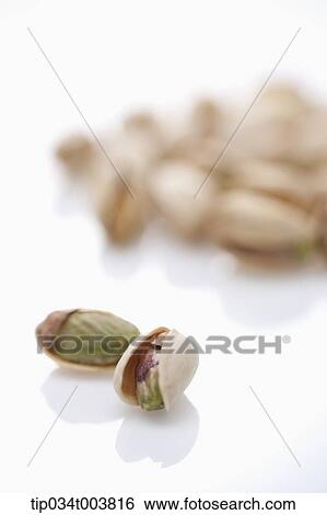 two pistachios in front of bunch of pistachios View Large Photo Image Stock Photograph - two pistachios in front of bunch of pistachios. Fotosearch