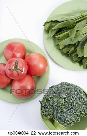 Stock Image - two tomatoes in white background . Fotosearch