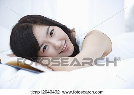 woman wearing white sleepwear and lying on her side View Large Photo Image Stock Image - woman wearing white sleepwear and lying on her side. Fotosearch