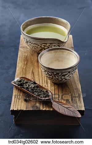 Stock Image - wooden tea tray with tea cups . Fotosearch