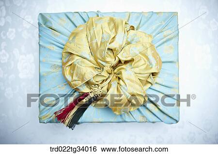 Stock Photograph - yellow bag on a traditional Korean package. Fotosearch