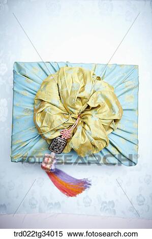 Stock Photography - yellow bag on a traditional Korean package. Fotosearch