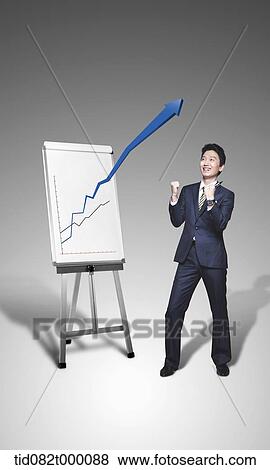 Stock Illustration - a businessman with a graph rising. Fotosearch
