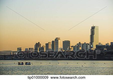 Stock Illustration - a city behind some water. Fotosearch