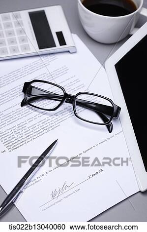 Clipart - a coffee cup, a tablet and papers. Fotosearch
