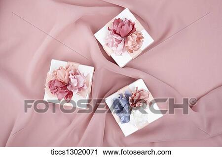 Clip Art - a gift with pink and blue flowers. Fotosearch