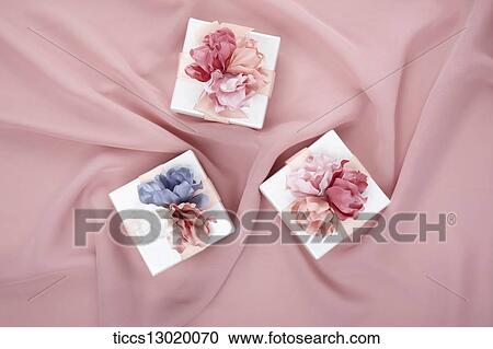 a gift with pink and blue flowers View Large Illustration Clipart - a gift with pink and blue flowers. Fotosearch