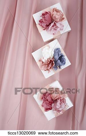 Stock Illustration - a gift with pink and blue flowers. Fotosearch