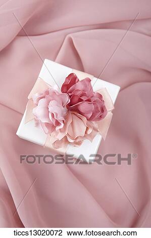 Drawing - a gift with pink flower. Fotosearch